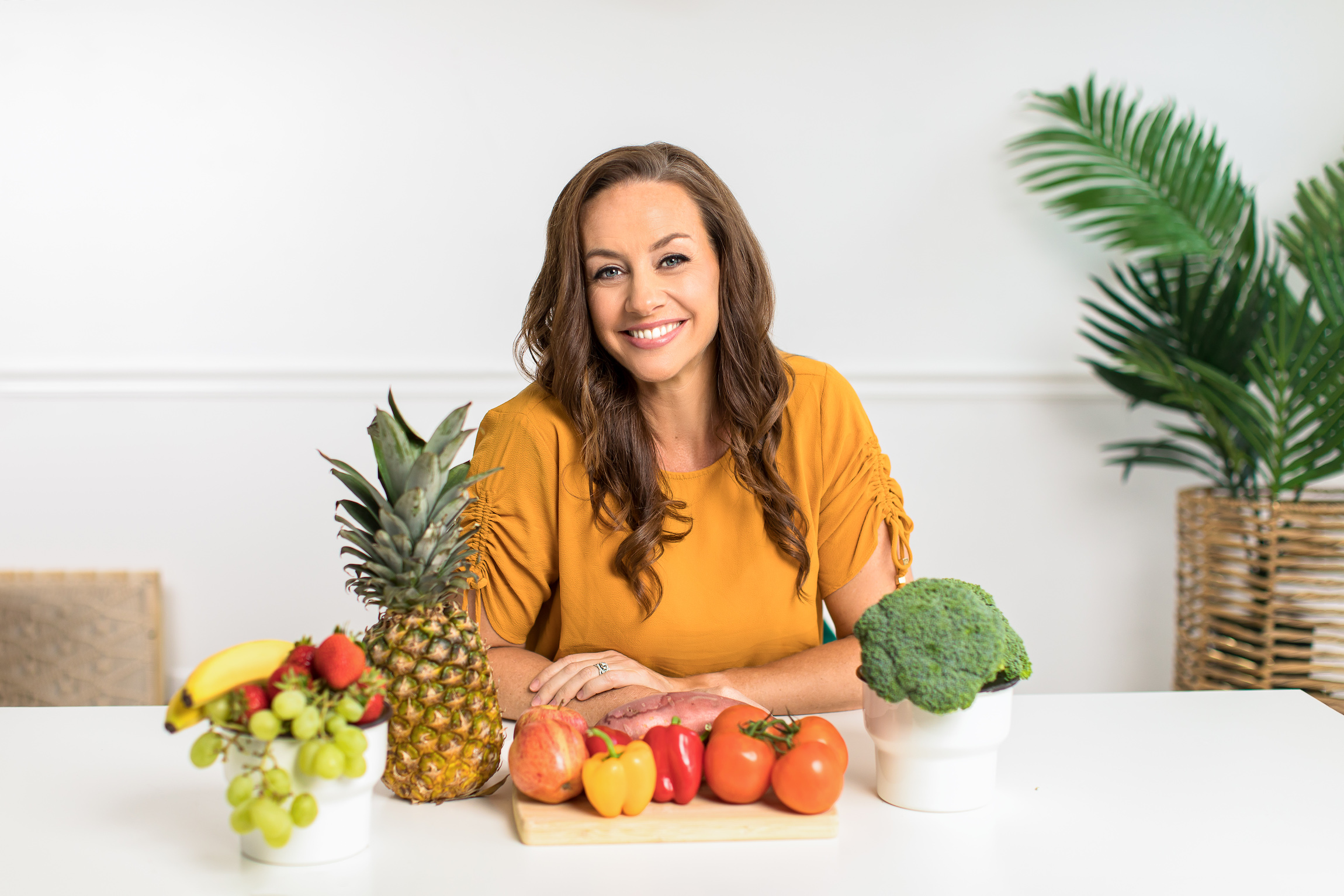 Stacy J with fresh fruit and vegetables